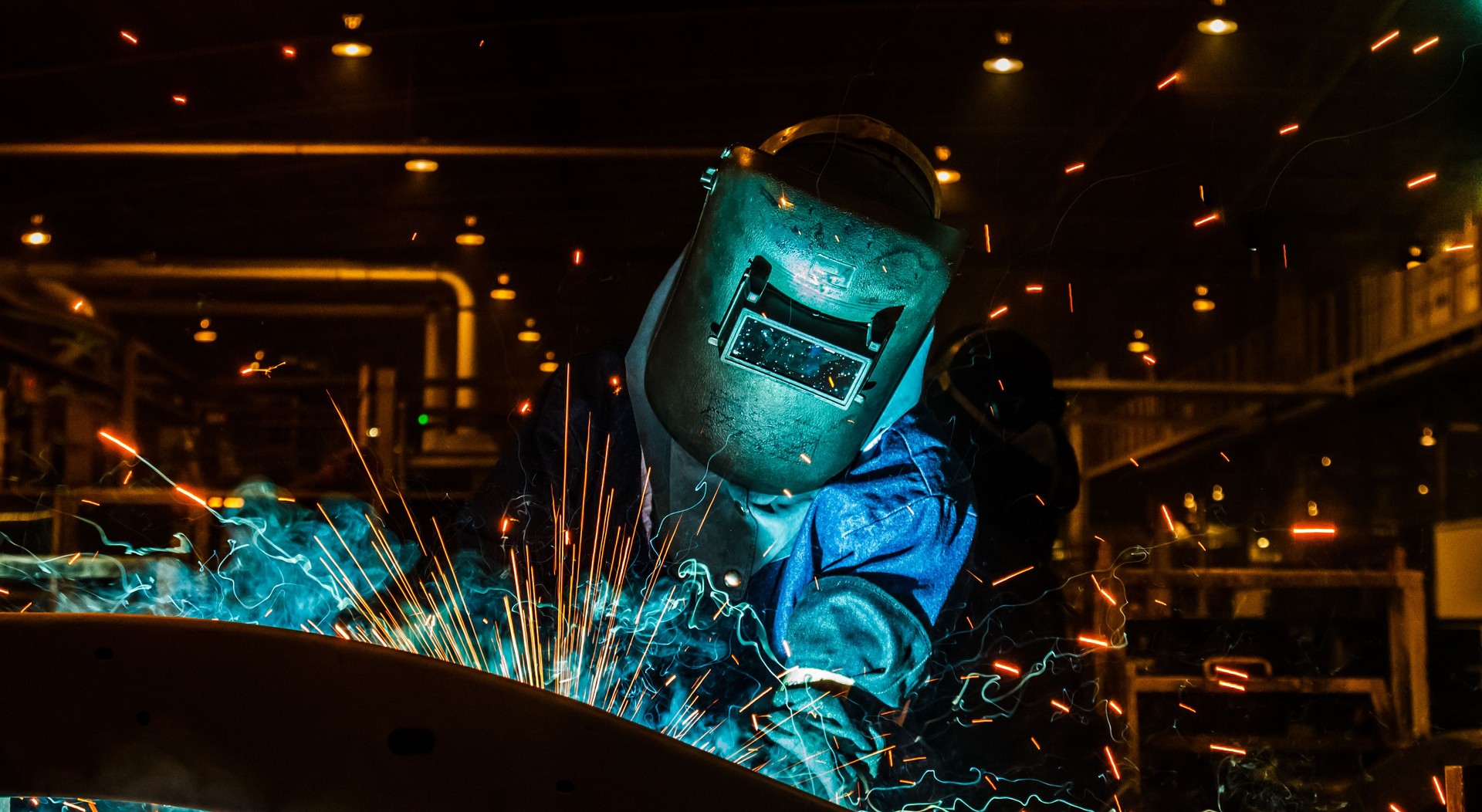 Worker,welding in a car factory